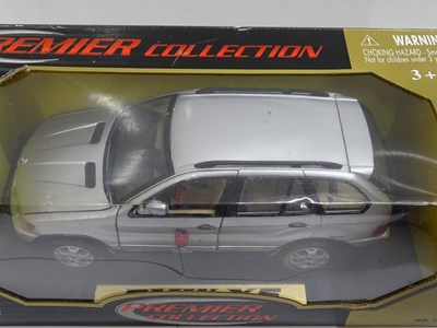 Lot 156 - A group of boxed 1:18 scale diecast cars by...