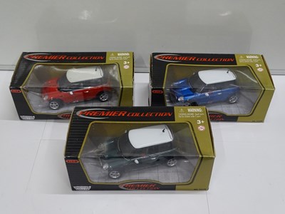 Lot 156 - A group of boxed 1:18 scale diecast cars by...