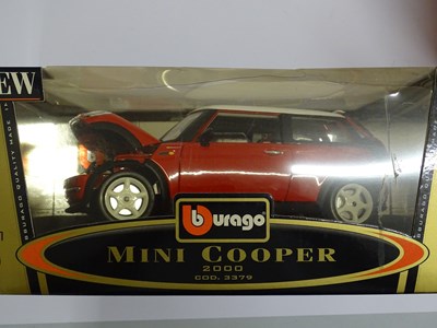 Lot 158 - A group of boxed 1:18 scale diecast cars by...