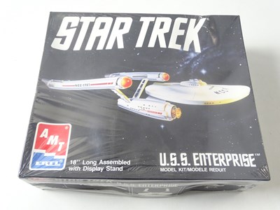 Lot 218 - An AMT unbuilt plastic kit of the USS...