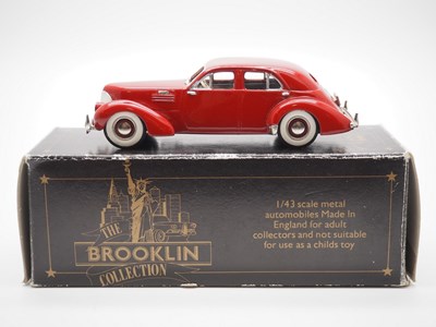 Lot 128 - A pair of 1:43 scale hand built white metal...