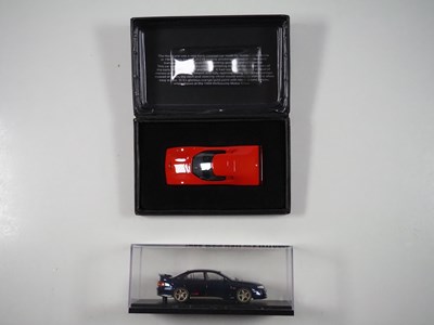 Lot 312 - A pair of 1:43 scale hand built resin models...