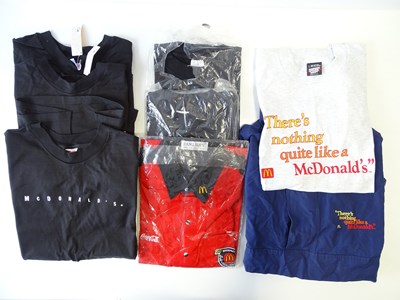 Lot 268 - MCDONALDS: A group of t-shirts, a crew shirt...