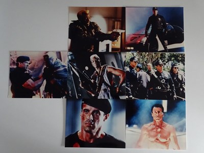 Lot 318 - A group of film stills for DEMOLITION MAN...