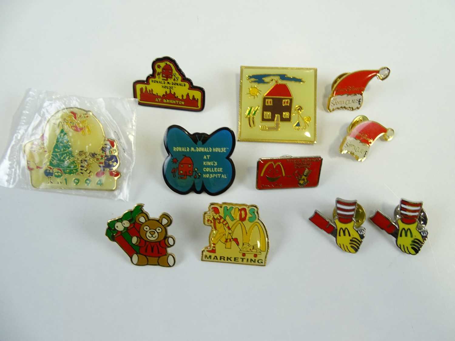 Lot 302 - A group of mixed MCDONALDS pins including...