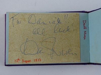 Lot 40 - A vintage autograph book containing a number...