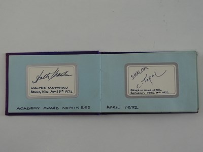 Lot 40 - A vintage autograph book containing a number...