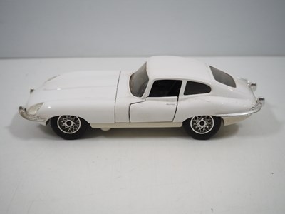 Lot 105 - A group of mostly unboxed diecast cars to...