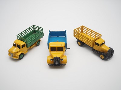 Lot 194 - A group of unboxed DINKY Toys trucks...