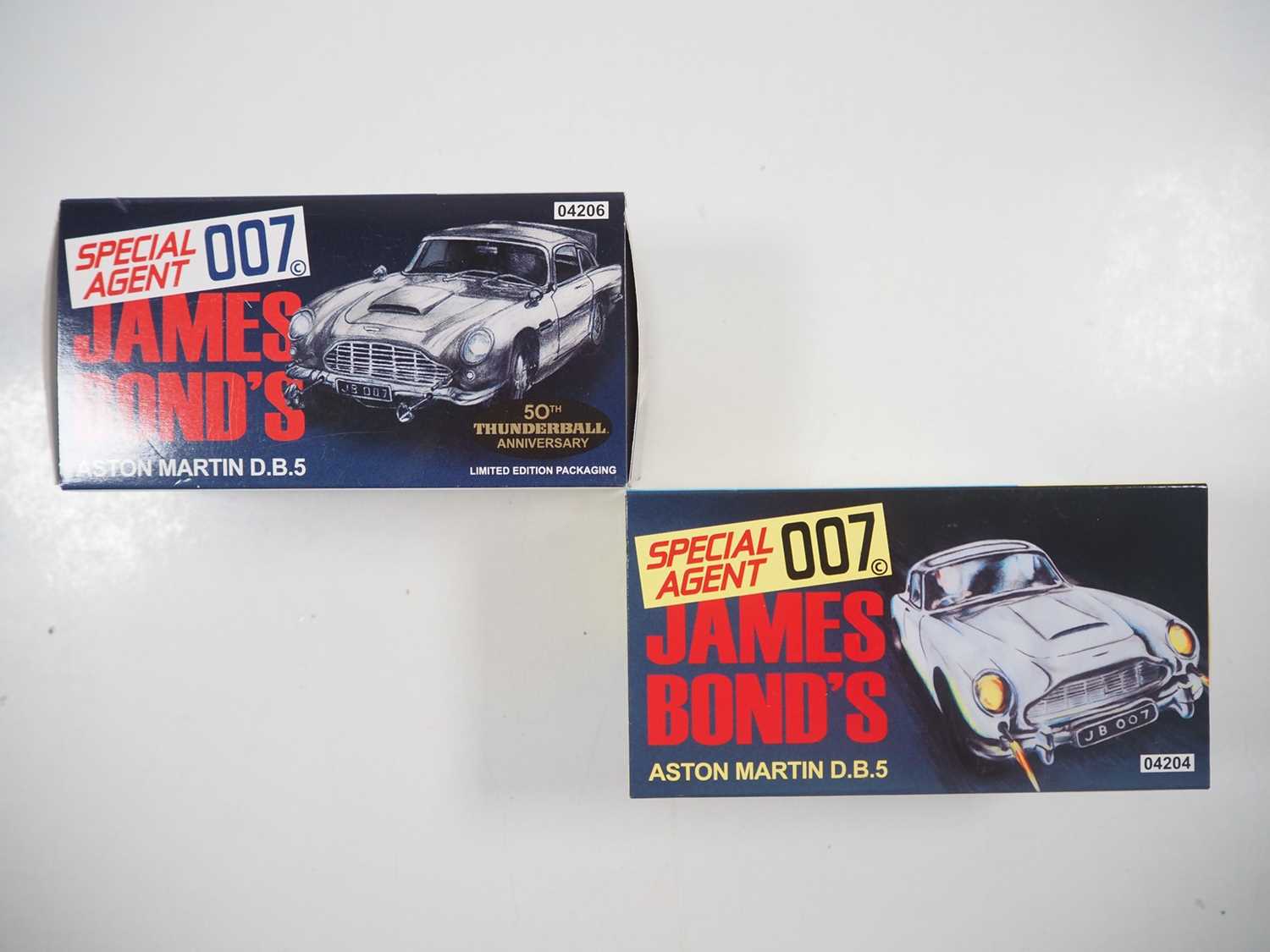 Lot 216 - A pair of CORGI James Bond Aston Martin DB5,...