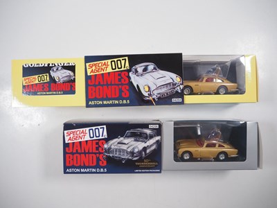 Lot 216 - A pair of CORGI James Bond Aston Martin DB5,...