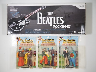 Lot 231 - A NINTENDO Wii 'The Beatles' Rock band guitar...