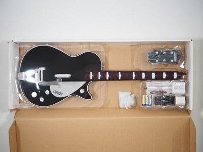 Lot 231 - A NINTENDO Wii 'The Beatles' Rock band guitar...