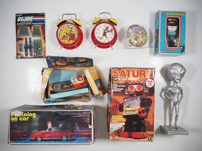 Lot 237 - A group of assorted toys plus novelty alarm...