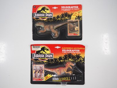 Lot 243 - A pair of carded Jurassic Park dinosaurs by...