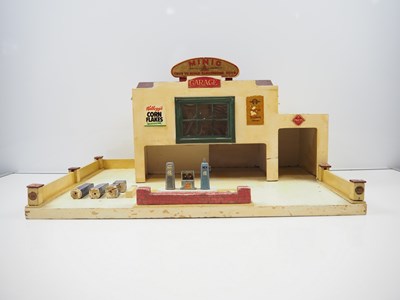 Lot 247 - A TRI-ANG MINIC wooden No.4 garage in good...