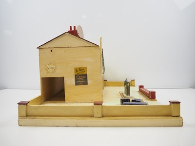 Lot 247 - A TRI-ANG MINIC wooden No.4 garage in good...