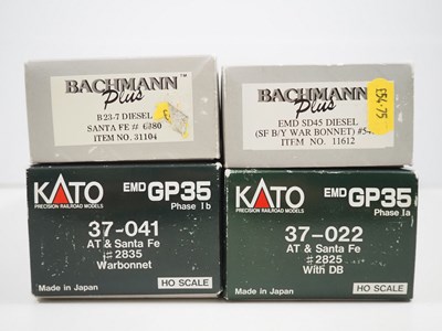 Lot 411 - A pair of KATO American outline HO gauge GP35...