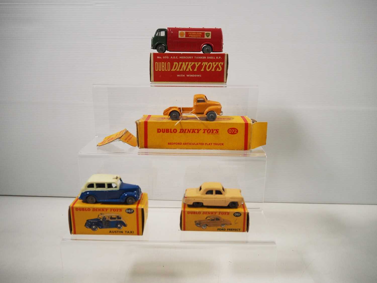 Fourteen Dublo Dinky Toys, comprising a No. 061 Ford Prefect, a No. 062 Fourteen Dublo Dinky Toys, comprising a No. 061 Ford Prefect, a No. 062