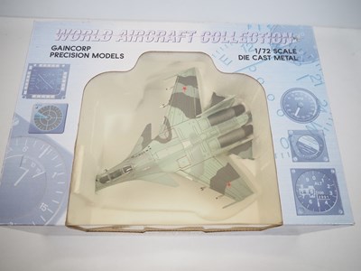 Lot 13 - A pair of diecast model planes comprising a...