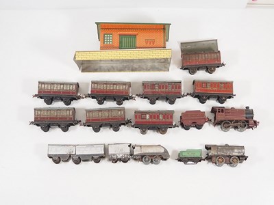 Lot 531 - A group of playworn O gauge clockwork locos,...