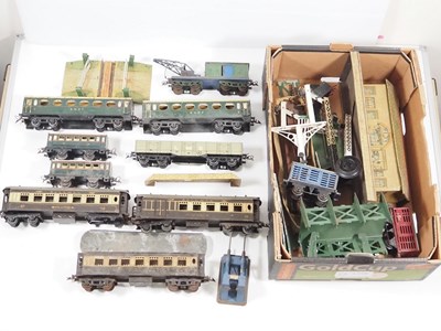 Lot 534 - A group of playworn O gauge rolling stock,...