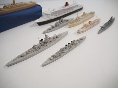 Lot 59 - A group of waterline ship models in various...