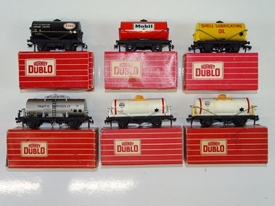 Lot 377 - A group of HORNBY DUBLO tank wagons in various...