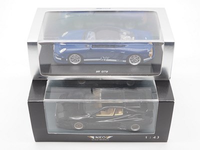 Lot 36 - A pair of hand built resin 1:43 scale models...