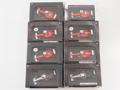 Lot 232 - A group of 1:43 scale Formula 1 race cars by...