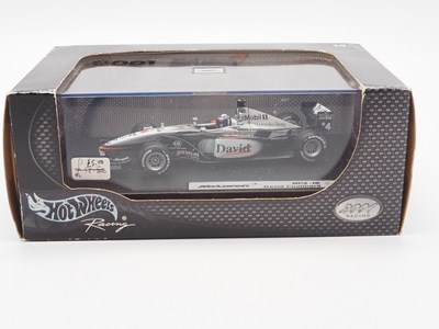 Lot 232 - A group of 1:43 scale Formula 1 race cars by...