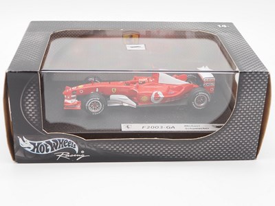 Lot 232 - A group of 1:43 scale Formula 1 race cars by...