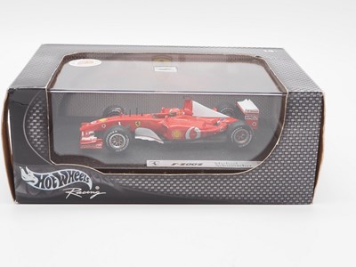 Lot 232 - A group of 1:43 scale Formula 1 race cars by...