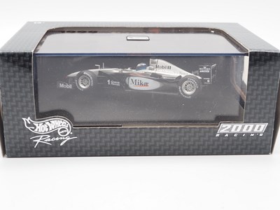 Lot 232 - A group of 1:43 scale Formula 1 race cars by...