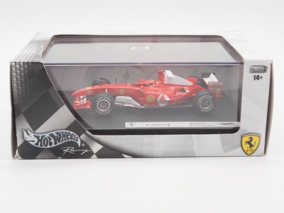 Lot 232 - A group of 1:43 scale Formula 1 race cars by...