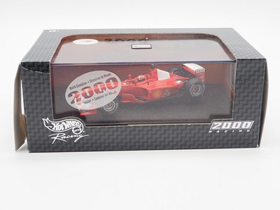 Lot 232 - A group of 1:43 scale Formula 1 race cars by...