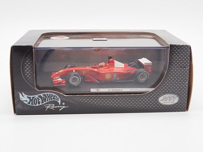 Lot 232 - A group of 1:43 scale Formula 1 race cars by...