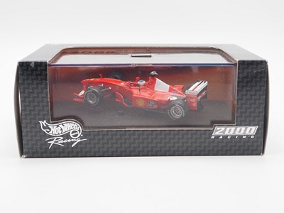 Lot 232 - A group of 1:43 scale Formula 1 race cars by...