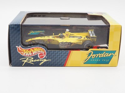 Lot 233 - A group of 1:43 scale Formula 1 race cars by...