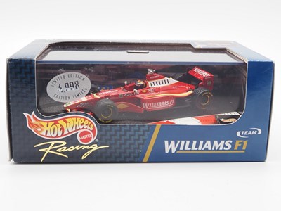 Lot 233 - A group of 1:43 scale Formula 1 race cars by...