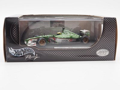 Lot 233 - A group of 1:43 scale Formula 1 race cars by...