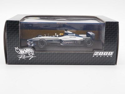 Lot 233 - A group of 1:43 scale Formula 1 race cars by...