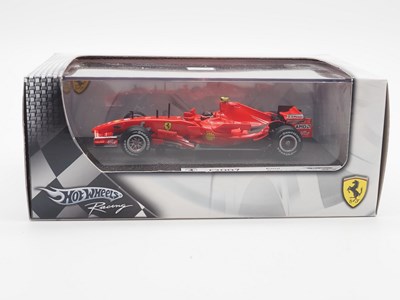 Lot 235 - A group of 1:43 scale Formula 1 race cars by...