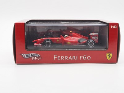 Lot 235 - A group of 1:43 scale Formula 1 race cars by...