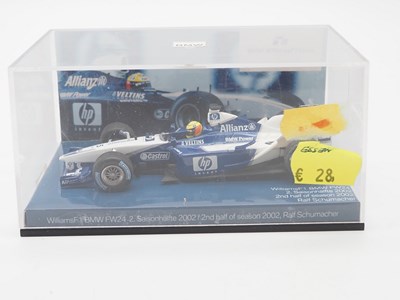 Lot 204 - A group of 1:43 scale Formula 1 race cars by...