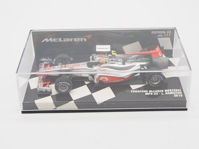 Lot 210 - A group of 1:43 scale Formula 1 race cars by...