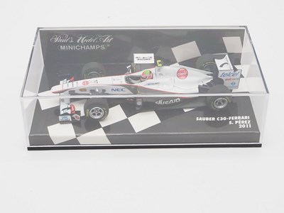 Lot 210 - A group of 1:43 scale Formula 1 race cars by...