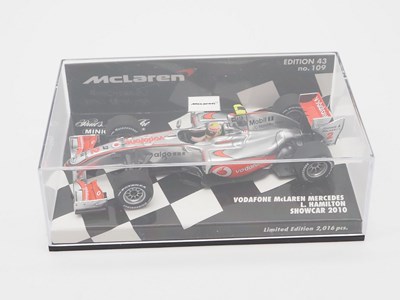 Lot 210 - A group of 1:43 scale Formula 1 race cars by...