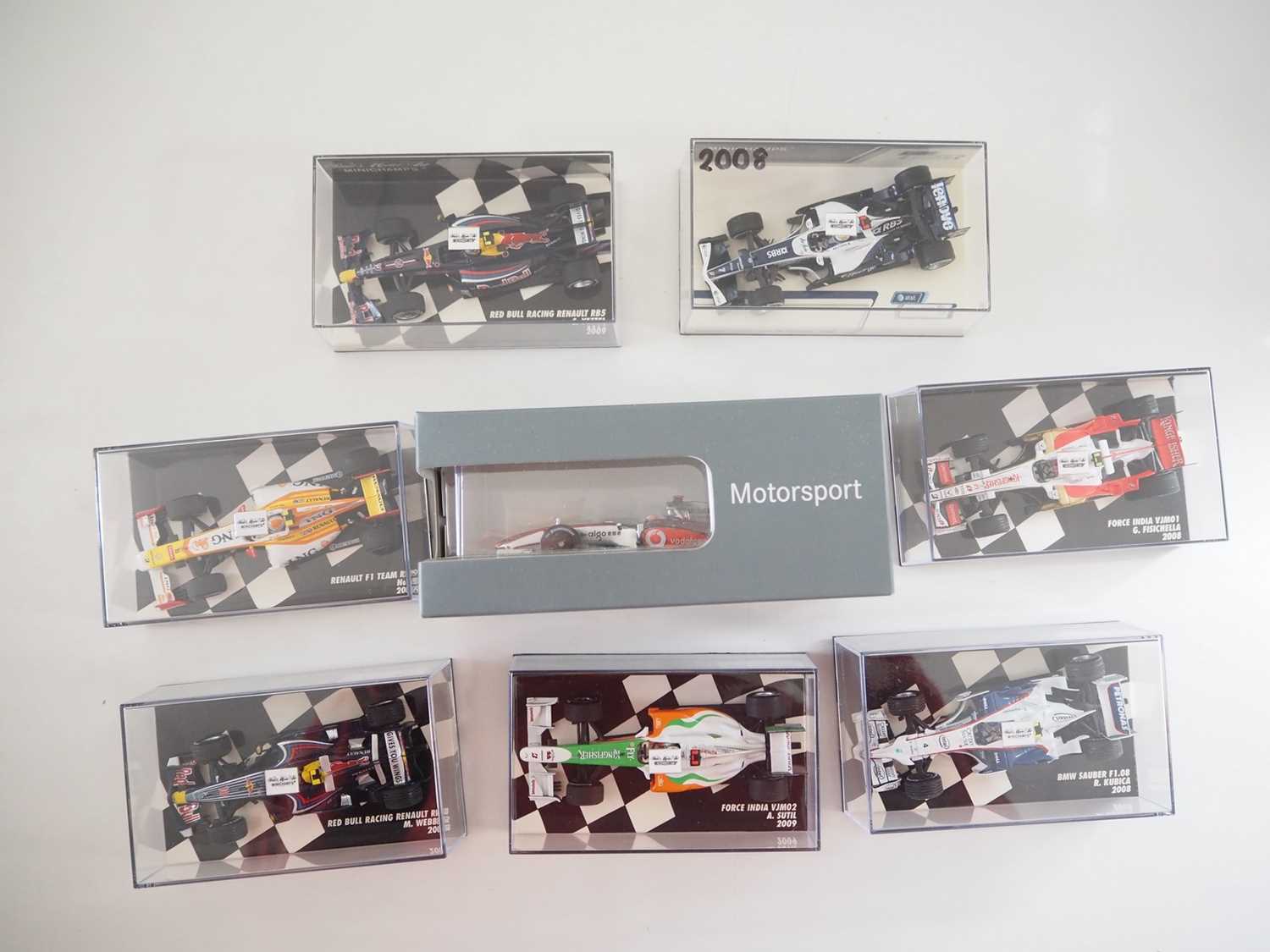 Lot 209 - A group of 1:43 scale Formula 1 race cars by...