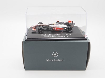 Lot 209 - A group of 1:43 scale Formula 1 race cars by...